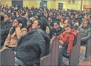  ??  ?? Upwards of 500 parishione­rs gather for the 6 p.m. Guadalupe service at St. Rocco on Tuesday. The other five services were equally packed.