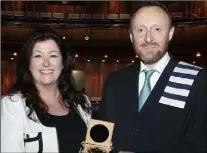 ??  ?? Carol O’Kelly presenting Brian O’Loan with the Brendan O’Kelly Memorial Medal for 1st Place in Aqua Business.