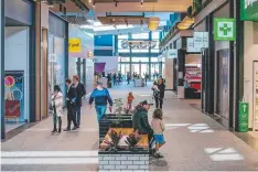  ??  ?? OPEN FOR BUSINESS: Shoppers test out the retail offerings at the new complex.