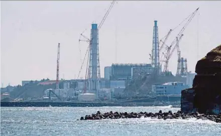  ?? AFP PIC ?? The Tokyo Electric Power Company Holdings Fukushima Daiichi nuclear power plant is seen from the coast of Futaba town in Fukushima prefecture recently.