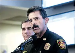  ?? Anne Cusack Los Angeles Times ?? L.A. FIRE CHIEF Ralph Terrazas, right, has said no one, including Mayor Eric Garcetti, left, received special treatment from LAFD during the Woolsey fire.