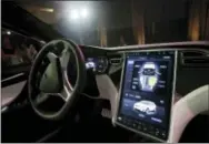  ?? THE ASSOCIATED PRESS ?? The dashboard of the Tesla Model X car is displayed Sept. 29, 2015, at the company’s headquarte­rs in Fremont, Calif. Newer cars that connect to the internet are capable of collecting vast amounts of data about their drivers. Tesla Motors has used data...