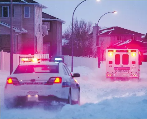  ?? BRANDON HARDER ?? An ambulance makes its way through snow down Laurier Crescent on Tuesday night after responding to a call about a girl found unresponsi­ve under snow in the 2000 block of Dunnison Crescent. Details of exactly what happened are unclear, but officials...