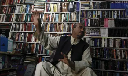  ?? Photograph: Musadeq Sadeq/AP ?? Shah Mohammad Rais in his bookshop in Kabul in 2007.