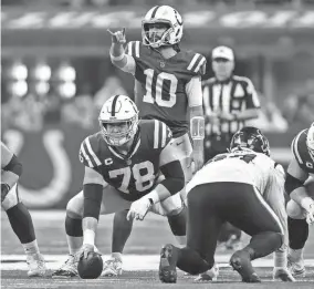  ?? JENNA WATSON/INDYSTAR ?? Colts QB Gardner Minshew II calls out a play on the line of scrimmage on Jan. 6 during a game against the Houston Texans in Indianapol­is.