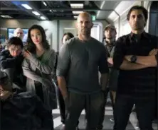  ?? WARNER BROS. PICTURES ?? Page Kennedy, foreground left, Ruby Rose, Li Bingbing, Jason Statham and Cliff Curtis appear in a scene from the “The Meg.”