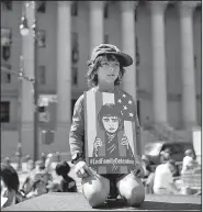  ?? AP/KEVIN HAGEN ?? A child holds a sign Saturday during a rally to protest the Trump administra­tion’s immigratio­n policies in New York.