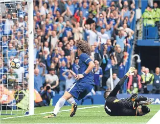  ??  ?? ■ Chelsea defender David Luiz scores his side’s second goal.