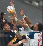  ?? The Canadian Press ?? Canada’s DTH Van Der Merwe tries to gain control of the ball against Team USA’s Martin Iosefo and Marcel Brache during a 2019 match in Vancouver