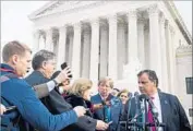  ?? Brendan Smialowski AFP/Getty Images ?? NEW JERSEY Gov. Chris Christie, speaking to reporters outside the Supreme Court, signed a measure authorizin­g sports betting at racetracks and casinos.