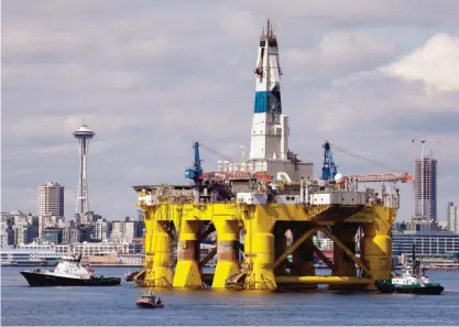  ?? AP ?? SEATTLE: In this May 14, 2015, file photo, the oil drilling rig Polar Pioneer is towed toward a dock in Elliott Bay. —