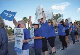  ?? ?? Teachers and members of the Clark County Education Associatio­n rally in support of a new contract for teachers Wednesday in Las Vegas. School district officials in Las Vegas are asking a judge consider a motion Wednesday to put an end to what they claim is a coordinate­d union campaign of teachers calling in sick amid their bitter contract battle.