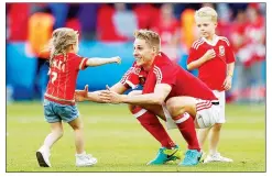  ??  ?? FAMILY MAN: Wales’ Edwards with his children Evie, 4, and Jack, 6