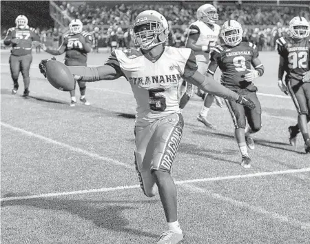  ?? MICHAEL LAUGHLIN/SUN SENTINEL ?? Stranahan running back Omar Graham scores against Fort Lauderdale during the second half of their game on Friday.