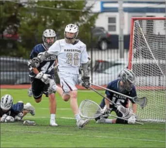  ?? PETE BANNAN — DIGITAL FIRST MEDIA ?? Haverford School’s TJ Malone (30), shown shredding Malvern Prep’s defense last month, produced five goals and an assist as the Fords outscored Penn Charter, 14-10, Friday in a key Inter-Ac League clash.