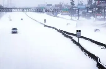  ?? AP file ?? EMPTY ROADS: Rare snowstorms and frigid temperatur­es last month kept drivers off the highways in Texas.