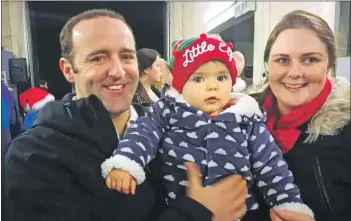  ?? a49InvChri­stmasLight­s15 ?? Wee Cameron waits to see Santa with dad Graham MacPherson and mum Beverley Watson. Daddy was slightly the more excited of the two boys.