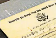  ?? PAT EATON-ROBB/AP ?? A World War I discharge paper awaits scanning at the Connecticu­t State Library in Hartford, Conn.