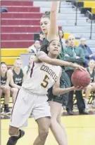  ?? Phoebe Sheehan / Times Union ?? Kyara Triblet (5), who led Colonie with 13 points, tries to shoot in front of Shen’s Cat Almeida on Friday.