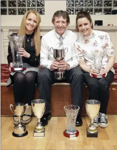  ??  ?? Catherine O’Connor, Bill Porter and Annmarie Kenny with Parnell AC’s impressive haul from 2017.