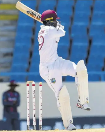  ?? (Photos: AFP) ?? West Indies batsman Nkrumah Bonner hits a four during the fifth and final day of the first Test match against Sri Lanka at Sir Vivian Richards Stadium in North Sound, Antigua yesterday.