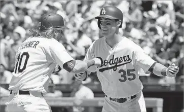  ?? Kevork Djansezian Getty Images ?? AN EARLY 5-0 deficit didn’t faze the Dodgers or Cody Bellinger, whose two-run home run in the third scored Justin Turner and made it 5-4. Bellinger went deep again in the eighth, the rookie’s sixth multi-homer game.