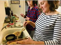  ?? ADDIE BROYLES / AMERICAN-STATESMAN ?? Applesauce muffins were a favorite childhood baking project, and my mom, sister and I recently remade them together in Missouri.