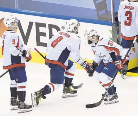  ?? AP ?? Alex Ovechkin (8) and Capitals celebrate comeback victory that keeps them alive in NHL playoffs Tuesday night in Toronto.