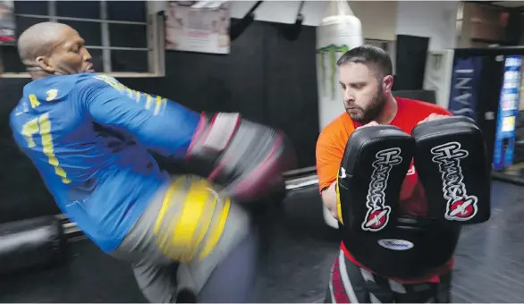  ?? PHOTOS: JORGE RIBAS/THE WASHINGTON POST ?? John (Doomsday) Howard, left, seen sparring at a gym in Somerville, Mass., says he made US$25,000 during his last UFC fight in December.