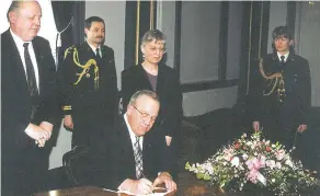  ?? Supplied photo ?? On March 7, 1997, the Honourable John E.N. Wiebe, Lieutenant Governor of Saskatchew­an, signed the proclamati­on of The Engineerin­g and Geoscience Profession­s Act, attended by Heinrich Feldkamp, P. Eng., FEC (APES President 1996 – 1997) and Frances...