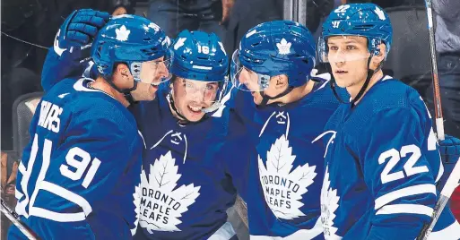  ?? MARK BLINCH GETTY IMAGES ?? John Tavares, Mitch Marner, Zach Hyman and (to a lesser extent) Nikita Zaitsev celebrate Marner’s second-period goal in Monday night’s 4-1 victory by the Maple Leafs over the Los Angeles Kings at Scotiabank Arena — their first game on home ice after a perfect four-game road swing.