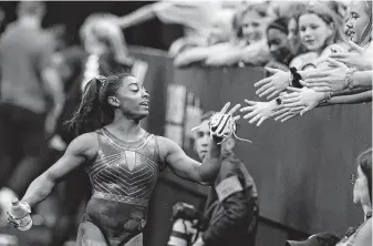  ?? Charlie Riedel / Associated Press ?? While a fan favorite in gymnastics venues the world over, Biles probably is the most underappre­ciated superstar athlete in the sports-rich Houston area.