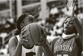  ?? Charlie Blalock / Contributo­r ?? Cypress Creek’s Taylor Jackson, a major presence in Saturday’s game, grabs a rebound during the Class 6A state semifinal game against Judson in Goliad.