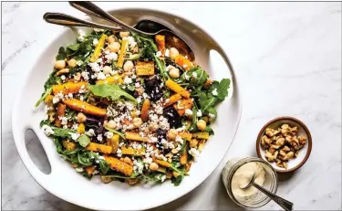  ?? BLANCHE SHAHEEN — COURTESY PHOTO ?? This warm, hearty salad uses peppery arugula and colorful radicchio, then amps up the flavor factor with root vegetables and chickpeas that have been roasted with smoky spices like cumin and paprika.