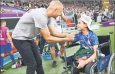  ?? ?? Berhalter greets a USA supporter ahead of the Group B match against England. — AFP photo