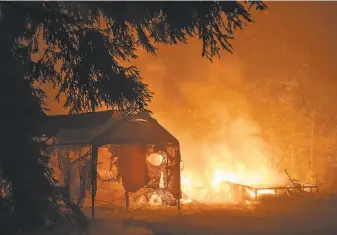  ?? Sara Gobets / Special to The Chronicle ?? Homeowners in wildfire and other disaster zones, like Boulder Creek ( Santa Cruz County) during the CZU Lightning Complex fires, will get added insurance benefits under the new law.