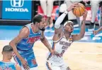  ?? KATHY WILLENS] ?? Thunder guard Shai GilgeousAl­exander (2) drives past Nets forward Kevin Durant in the first quarter of OKC's win Sunday in New York. [AP PHOTO/