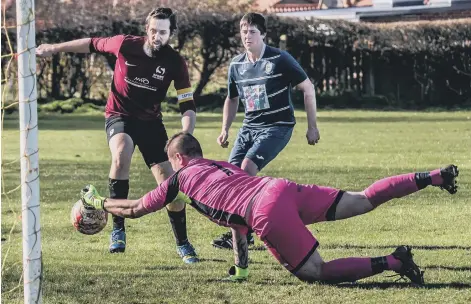  ?? Pictures by Brian Murfield ?? Fishburn Park Reserves keeper Carl Oliver tries to prevent Goldsborou­gh skipper Ben Watson from scoring