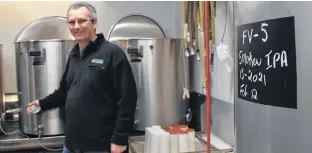  ??  ?? Mike Peters stands in the small-batch brewing room he runs out of a Cottage Street building that is commonly known as the old smokehouse in Berwick.