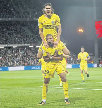  ??  ?? PSG’s Kylian Mbappe, No.29, celebrates his goal with Edinson Cavani.