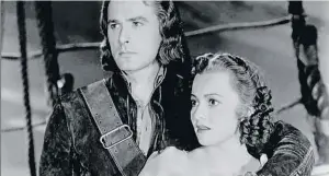  ??  ?? Con Errol Flynn, peligroso seductor, actuó en ocho películas, algunas tan famosas como
Robín de los bosques (1938) o Murieron con las botas puestas
(1941). A la izquierda, la primera que rodaron, Capitán Blood