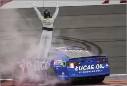  ?? JAE C. HONG — THE ASSOCIATED PRESS ?? Kyle Busch celebrates after winning a NASCAR Cup Series race at Auto Club Speedway in Fontana last Sunday.