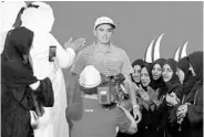 ?? KARIM SAHIB/AFP/GETTY IMAGES ?? Rickie Fowler looks on as he celebrates after winning the Abu Dhabi Golf Championsh­ip in the United Arab Emirates.