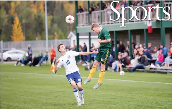 ?? CITIZEN PHOTO BY JAMES DOYLE ?? Aidan Way of the UNBC Timberwolv­es men’s soccer team leaps to head the ball away from UBC Thunderbir­ds forward Luke Griffin last Saturday at the North Cariboo Senior Soccer League fields. The T-wolves lost this game 4-1 but upset UBC 1-0 the day...