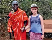  ??  ?? Holly Dean says hi to a Maasai warrior.