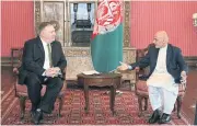  ?? AFP ?? Afghanista­n’s President Ashraf Ghani, right, speaks with US Secretary of State Mike Pompeo in Kabul on Monday.