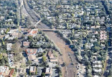  ?? Mel Melcon Los Angeles Times ?? MUD AND debris cover the 101 Freeway, which is expected to remain closed through next week. With utilities knocked out in much of the area, rescue crews fear that those who are trapped could run short on supplies.