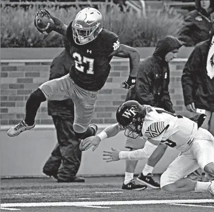  ?? JONATHAN DANIEL/GETTY ?? Notre Dame cornerback Julian Love, shown returning an intercepti­on against Wake Forest, is the Irish’s career leader in pass breakups with 39.