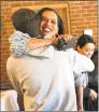  ?? Luther Turmelle / Hearst Connecticu­t Media ?? U.S. Rep. Jahana Hayes, D-5, hugs Dan Moran, a Cheshire High School freshman who worked on her congressio­nal campaign.