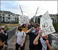  ?? PHOTO BY HYOUNG CHANG/ THE DENVER POST) ?? Protesters hold a rally for George Floyd at Denver on May 28, 2020.